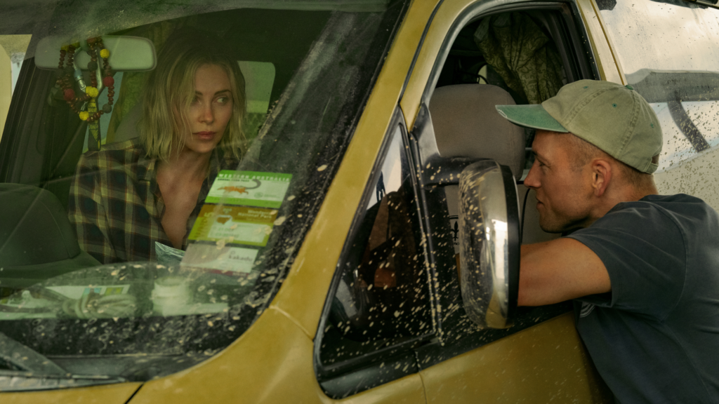 Charlize Theron as Sasha, Taron Egerton as Ben